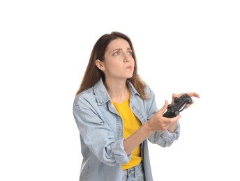 Woman playing video game with controller on white background