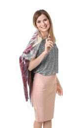 Young woman holding hanger with dress in plastic bag on white background. Dry-cleaning service