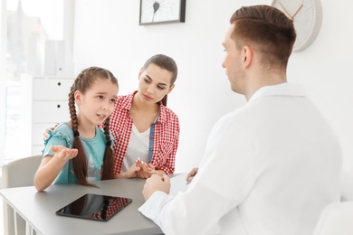 Young woman with her daughter having appointment at child psychologist office