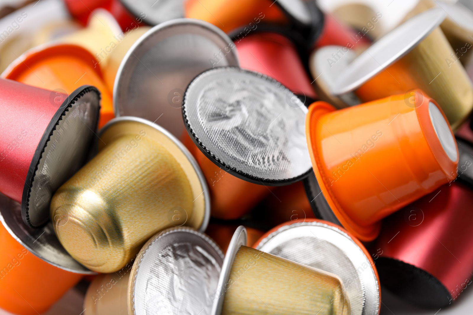 Photo of Many coffee capsules on table, closeup view