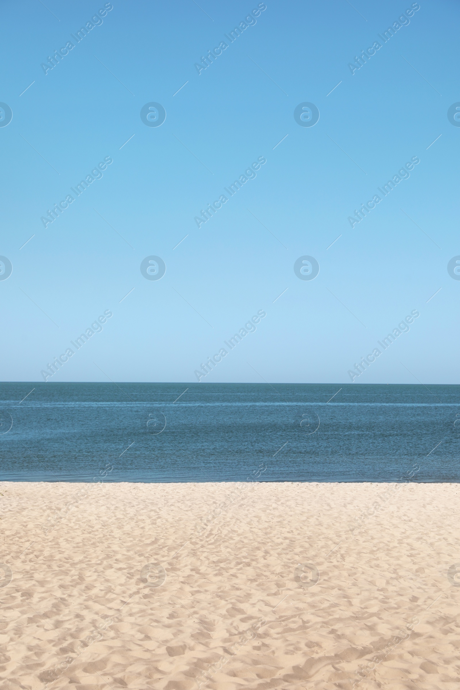 Photo of Sandy beach near sea on sunny summer day