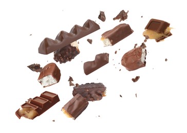 Image of Whole and broken chocolate bars falling on white background