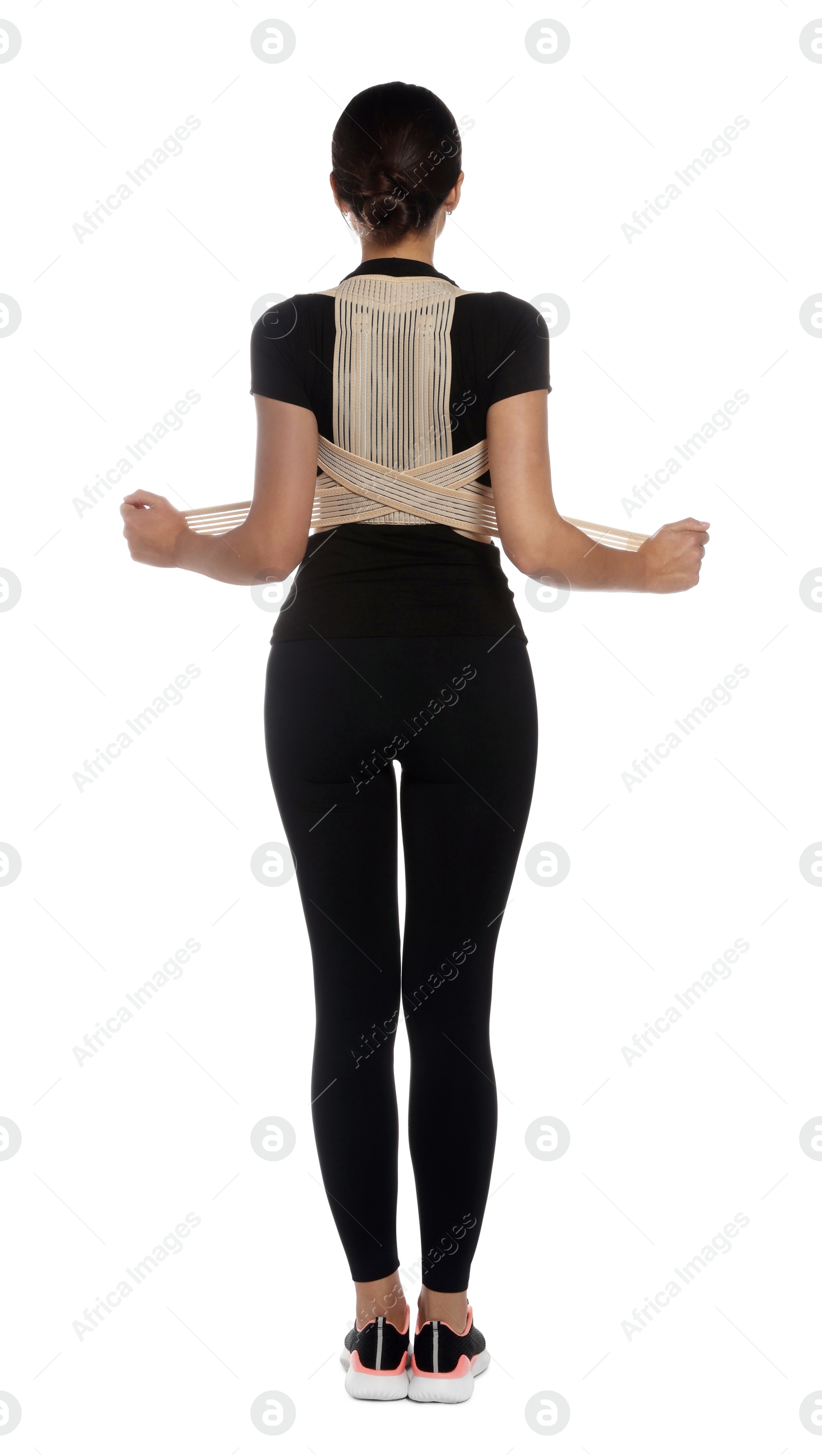 Photo of Woman with orthopedic corset on white background, back view