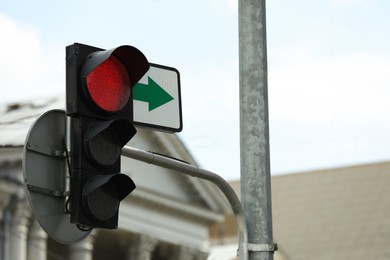 Photo of View of traffic light in city on sunny day