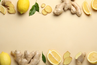 Fresh lemons and ginger on beige background, flat lay. Space for text