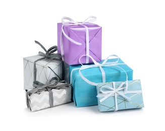 Photo of Heap of beautiful gift boxes on white background