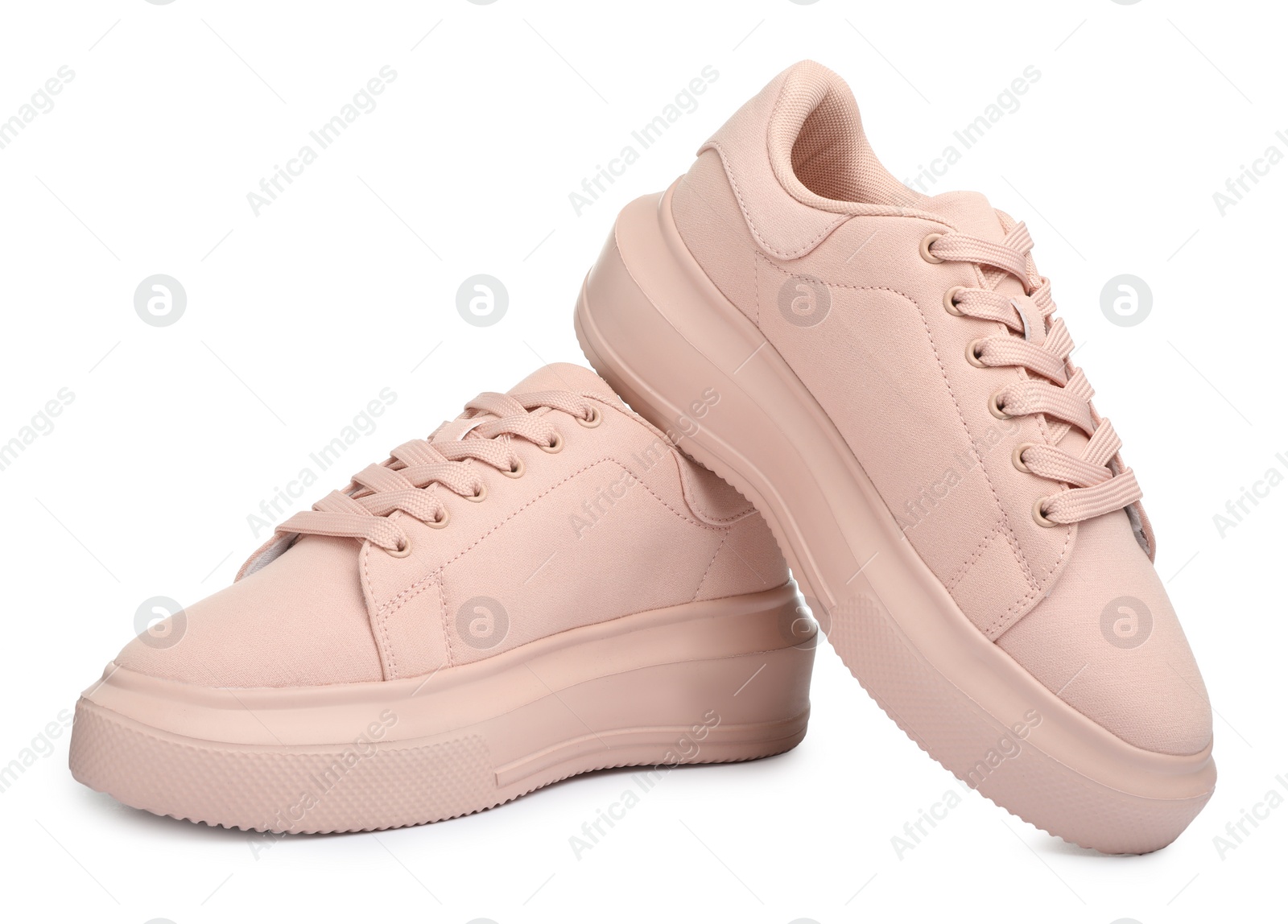 Photo of Pair of comfortable pink shoes on white background