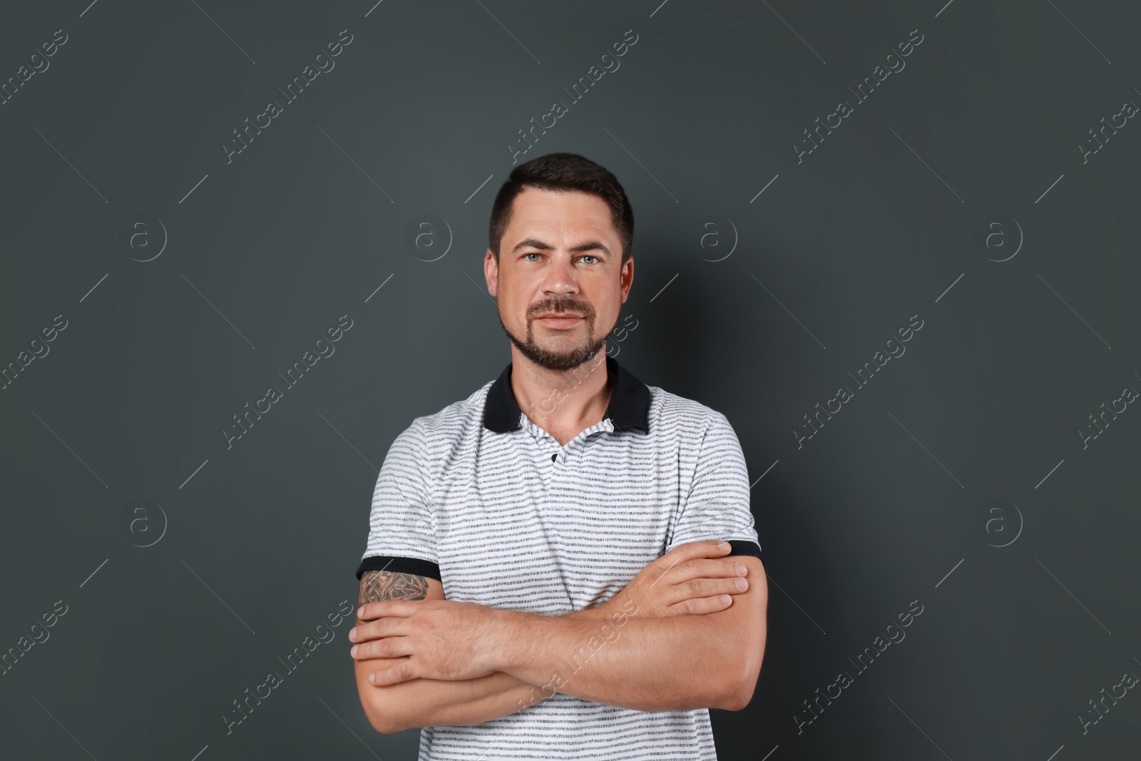 Photo of Portrait of handsome man on dark background