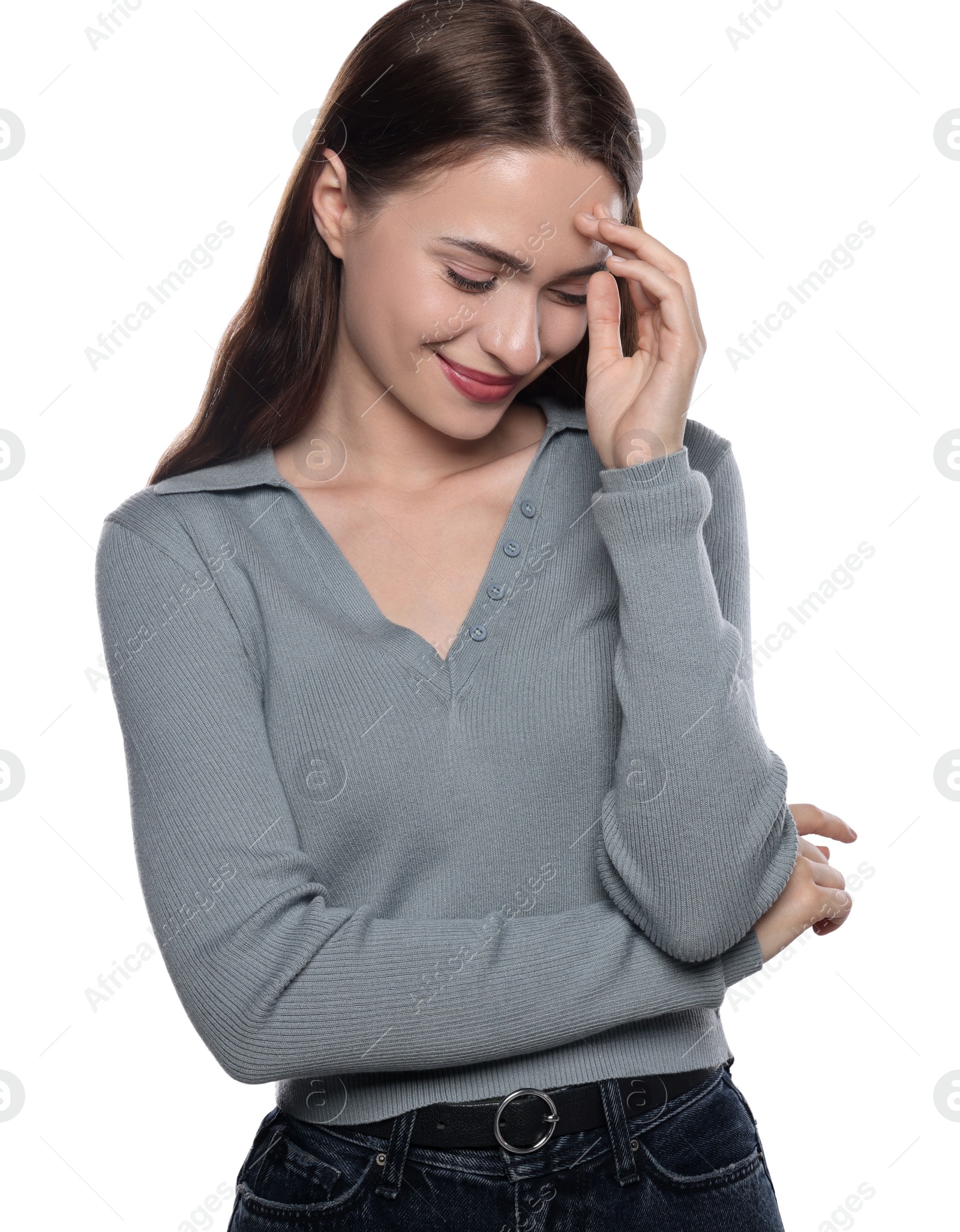 Photo of Embarrassed young woman covering face with hand on white background