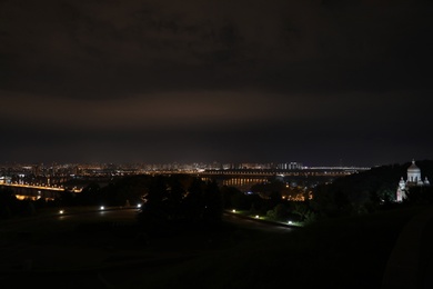 Photo of Beautiful view of bridge with illumination in modern city at night