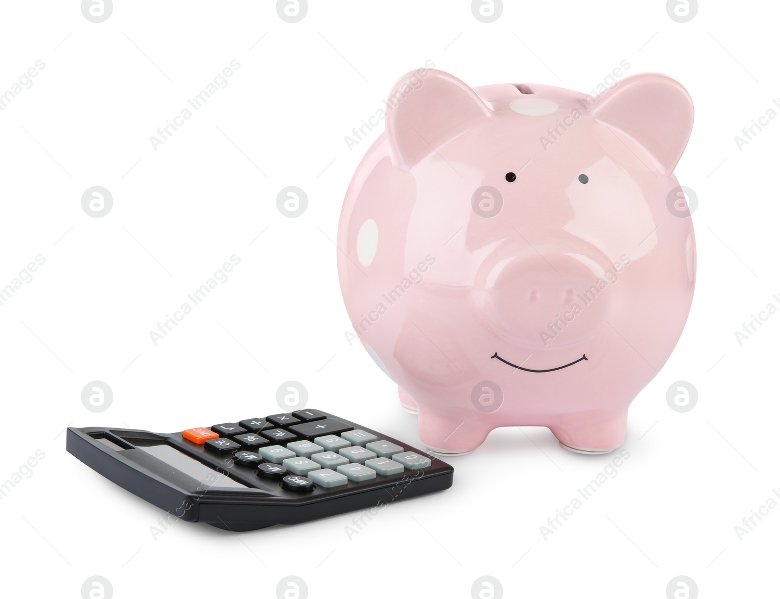 Photo of Calculator and pink piggy bank isolated on white