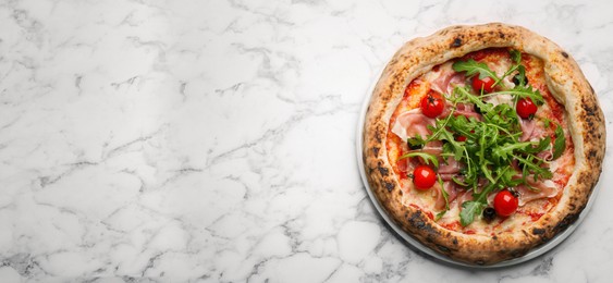 Image of Tasty pizza with meat and arugula on white marble table, top view with space for text. Banner design