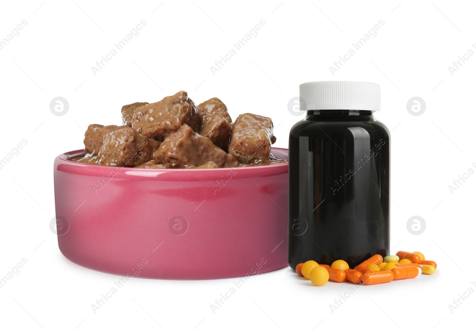 Image of Wet pet food in feeding bowl and bottle with vitamin pills on white background