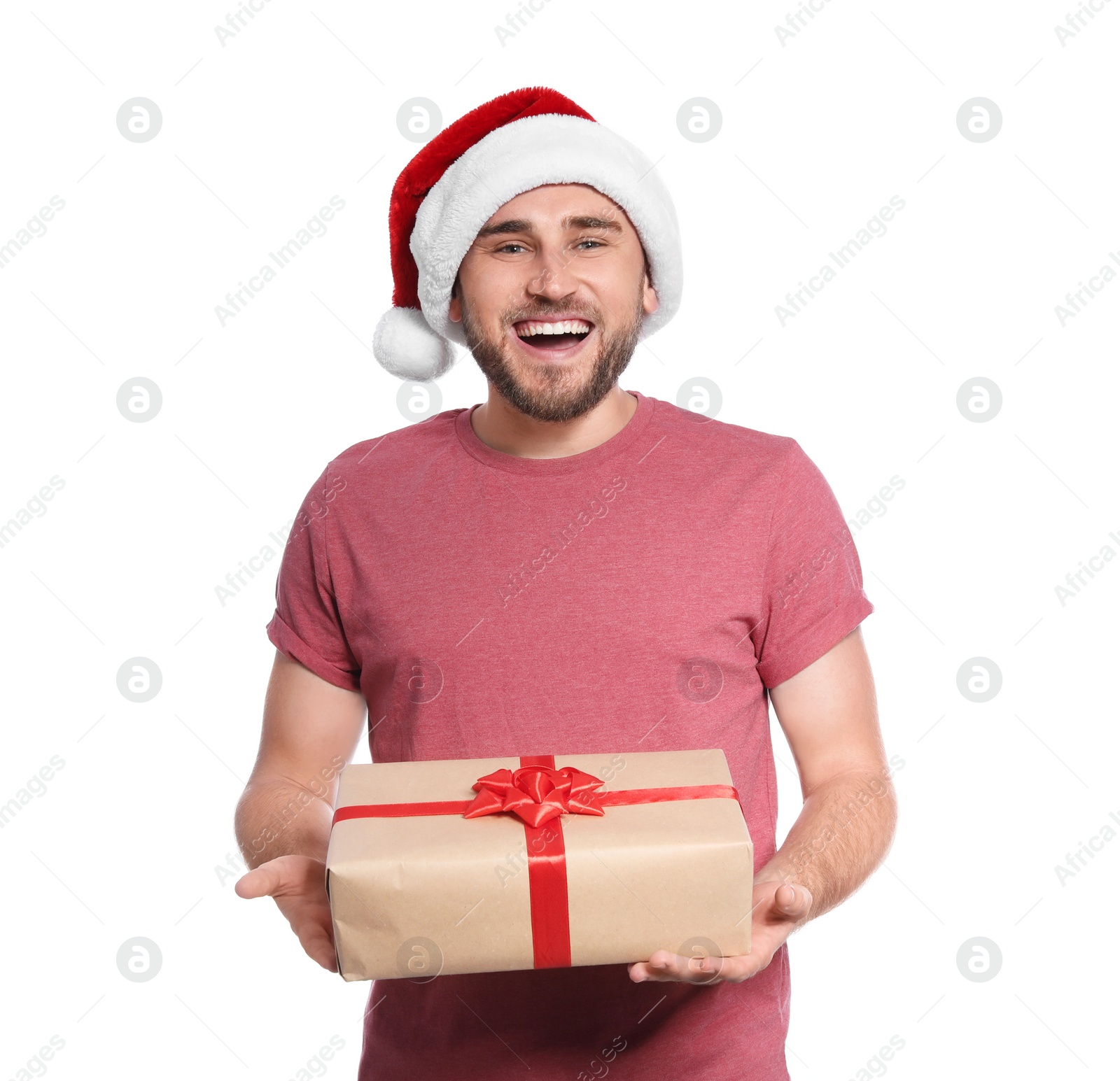 Photo of Young man with Christmas gift on white background