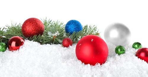 Photo of Christmas decoration on snow against white background