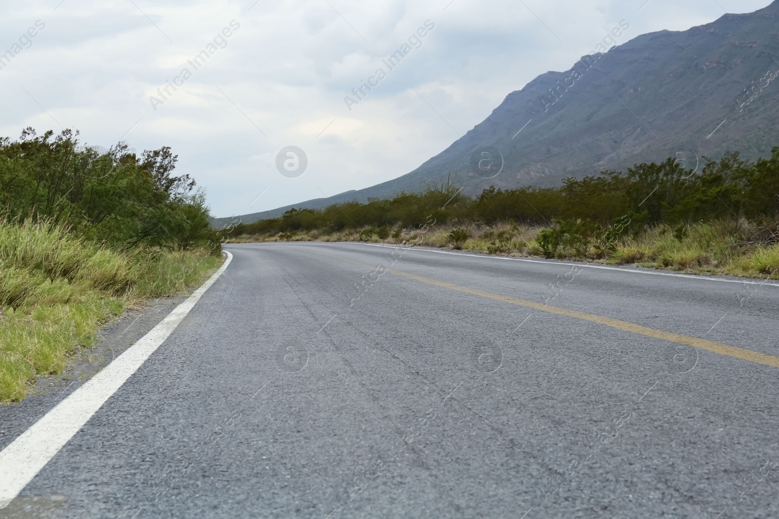 Photo of Beautiful view of empty asphalt highway outdoors. Road trip