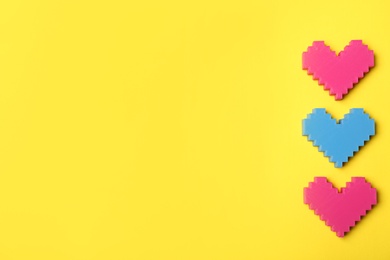 Photo of Colorful hearts on color background, top view with space for text