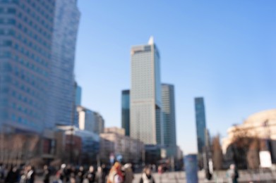 Photo of Blurred view of cityscape with modern buildings on sunny day