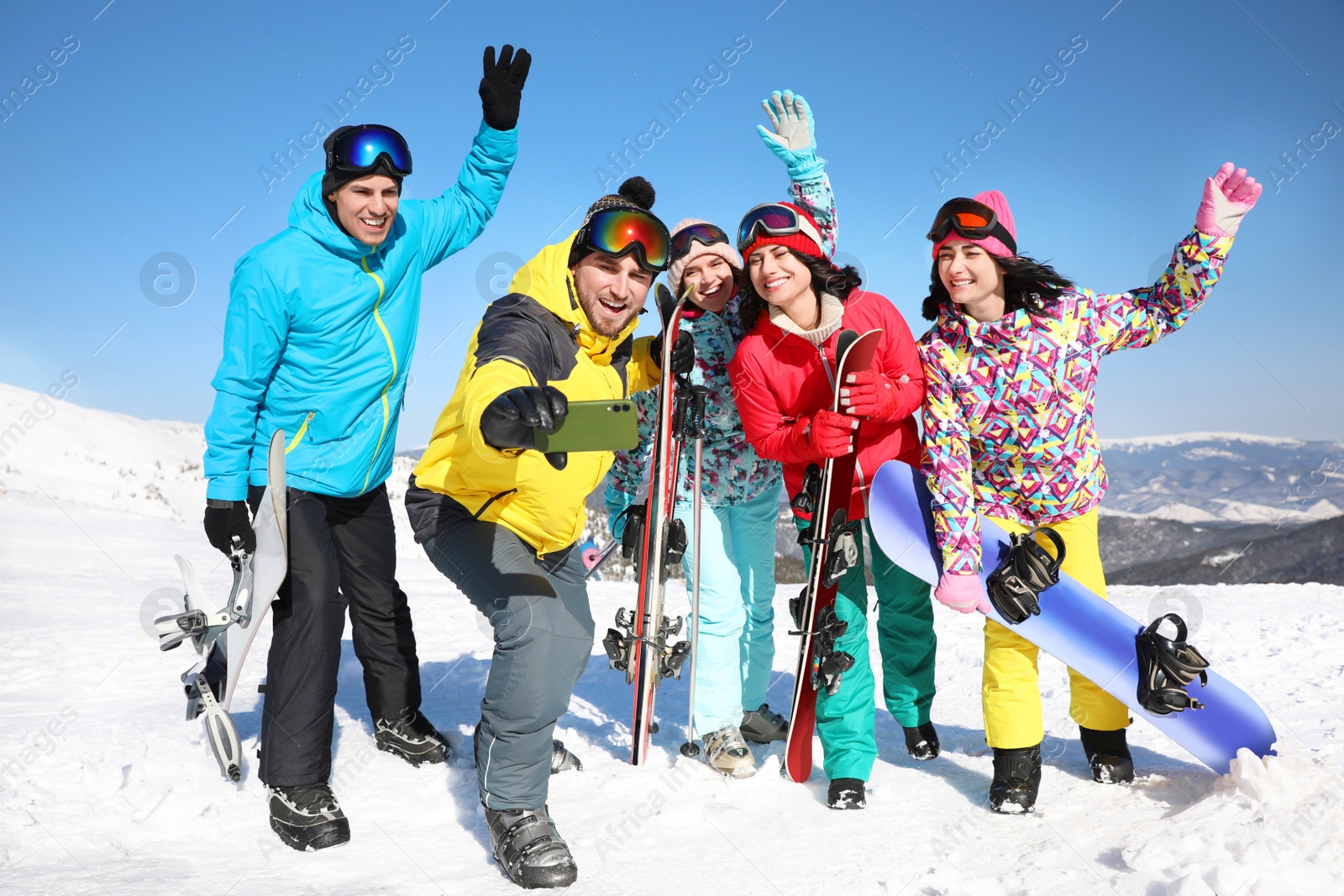 Photo of Group of friends taking selfie outdoors. Winter vacation