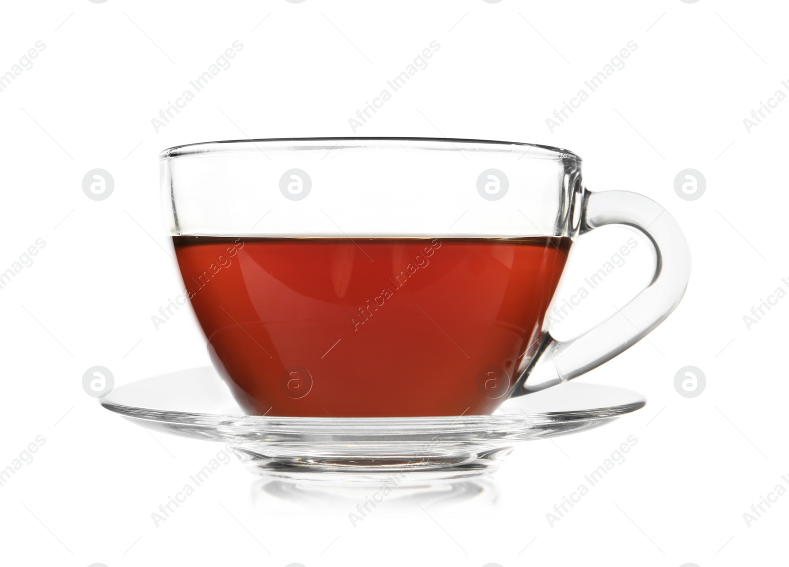 Photo of Glass cup of tea and saucer on white background