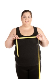 Photo of Overweight woman with measuring tape on white background