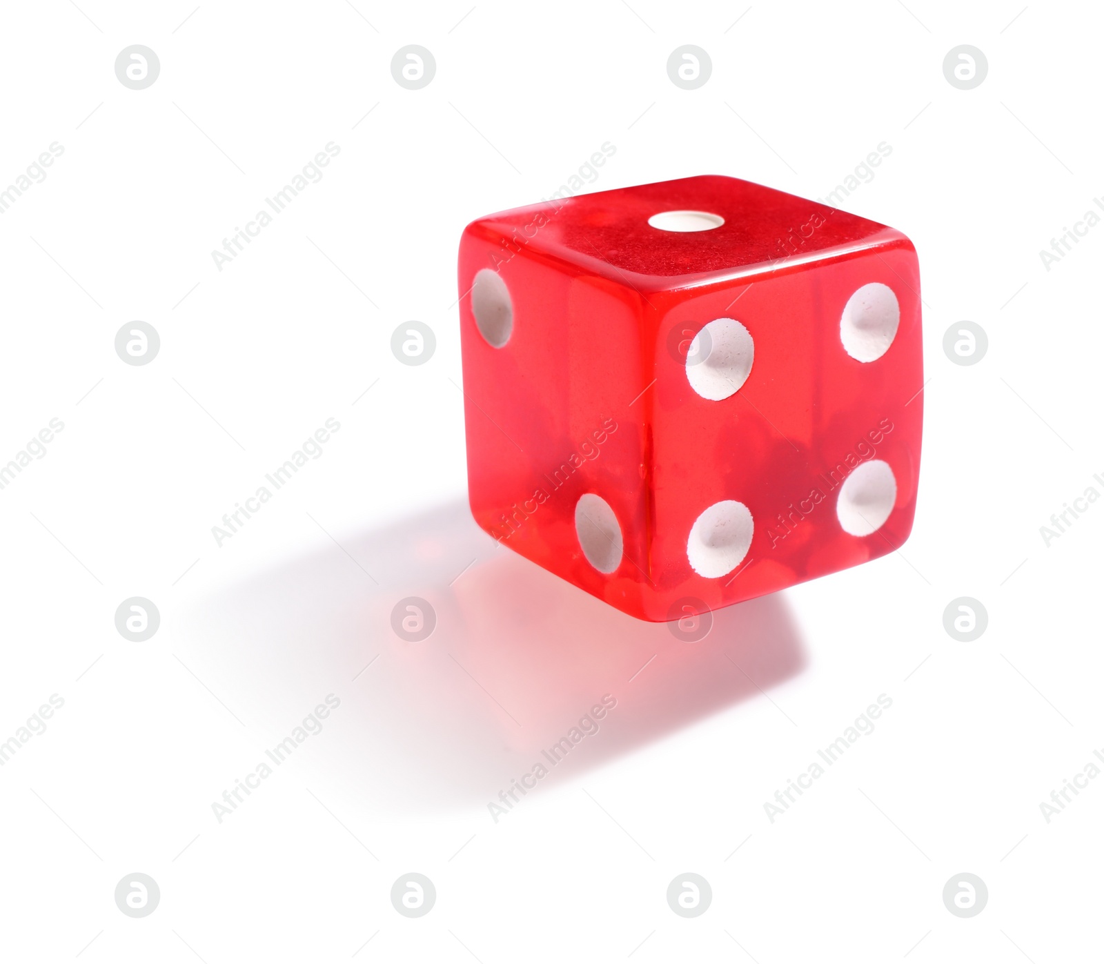 Photo of One red game dice isolated on white