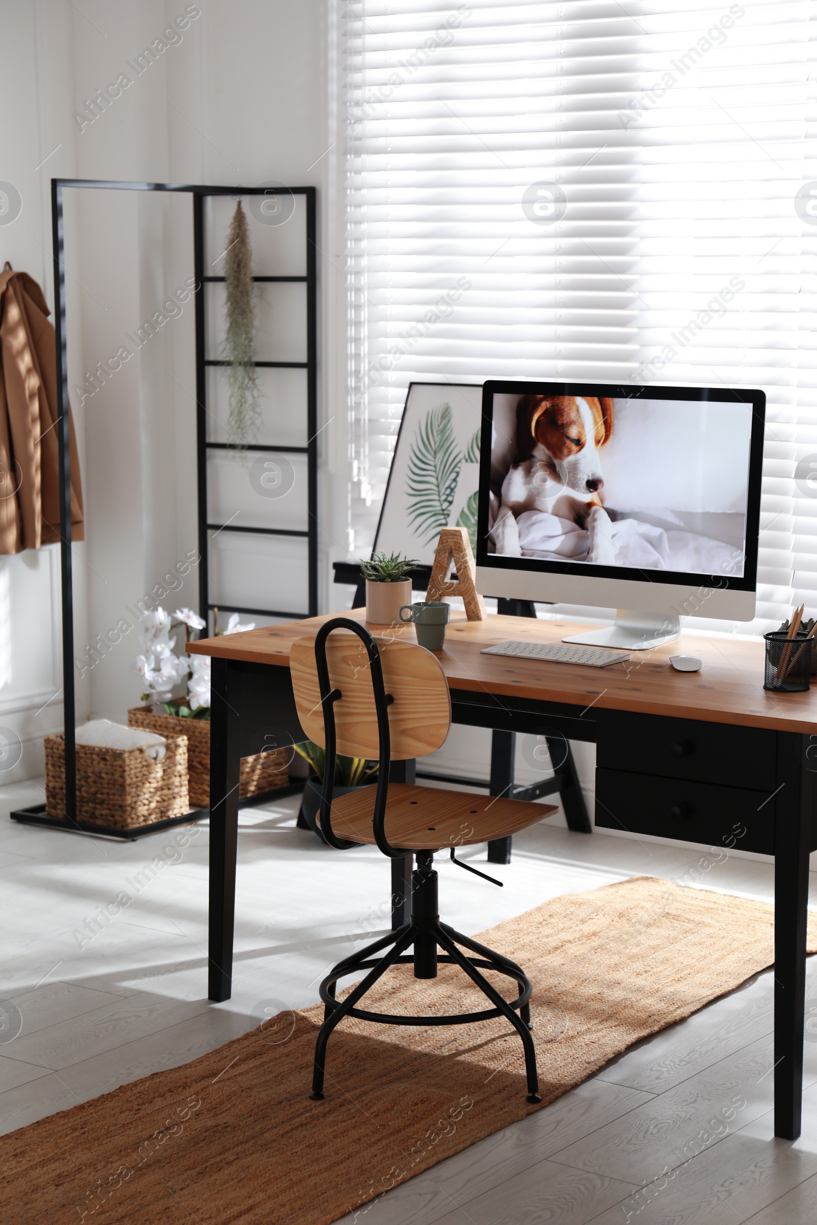 Photo of Stylish home office interior with comfortable workplace