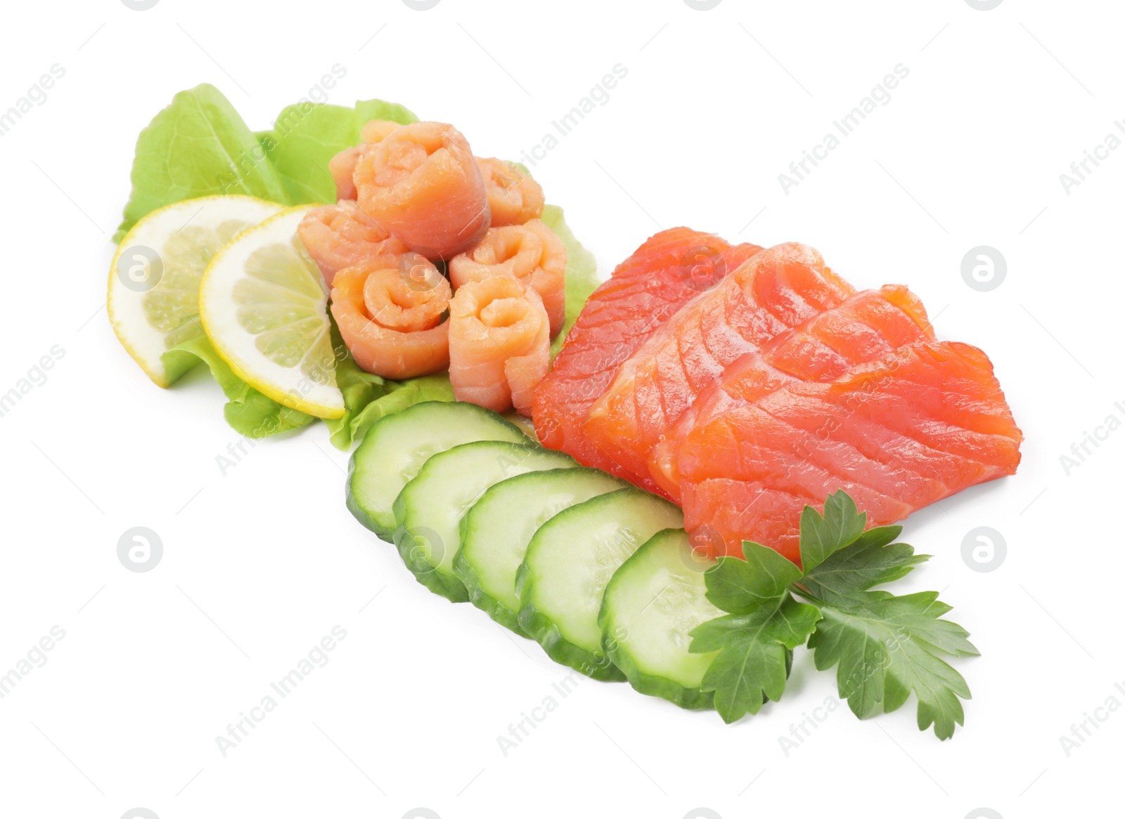 Photo of Delicious salmon sashimi served with lemon, cucumbers, parsley and lettuce isolated on white