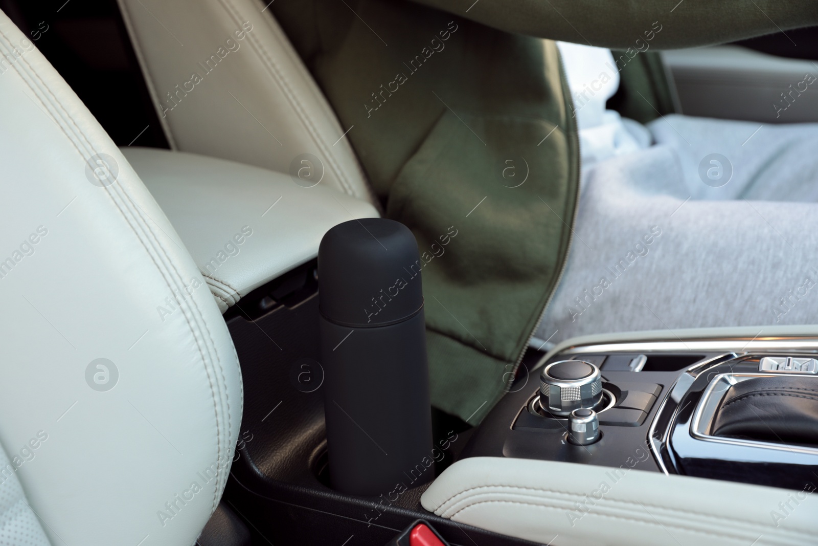 Photo of Black thermos in holder inside of car
