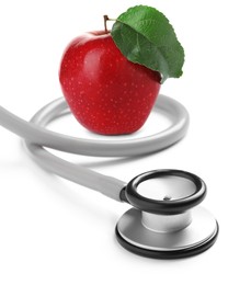 Image of Stethoscope and red apple on white background 