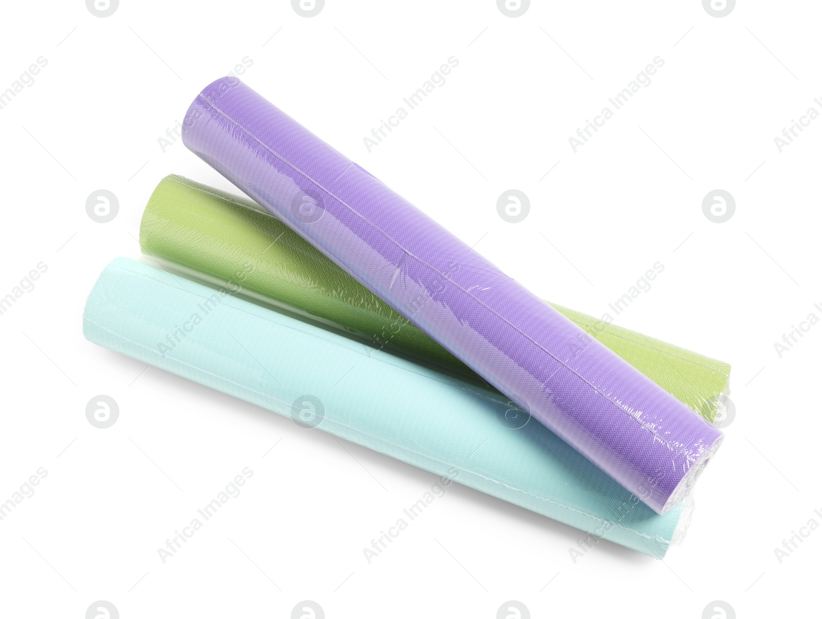 Photo of Three colorful wallpaper rolls isolated on white