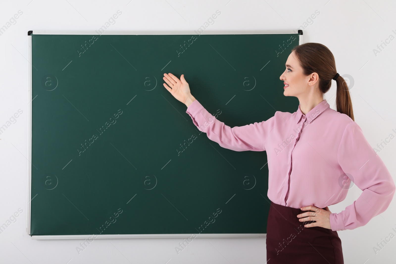 Photo of Portrait of young female teacher in classroom