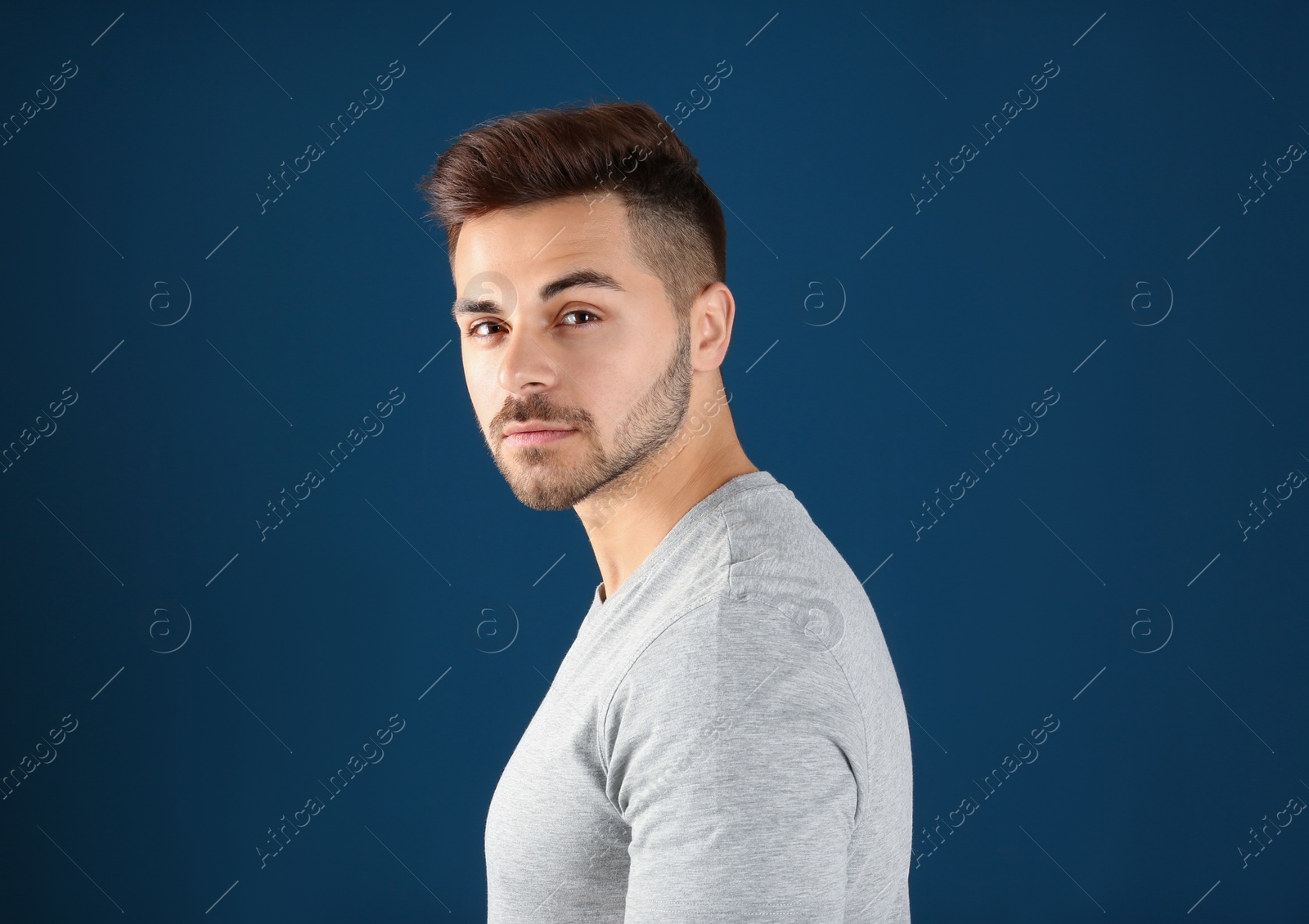 Photo of Portrait of handsome man on color background. Space for text