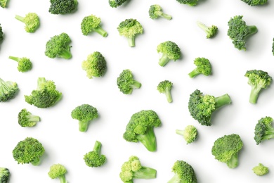 Photo of Flat lay composition with fresh green broccoli on light background