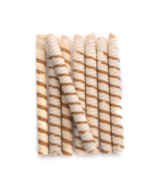 Tasty wafer roll sticks on white background, top view. Crispy food