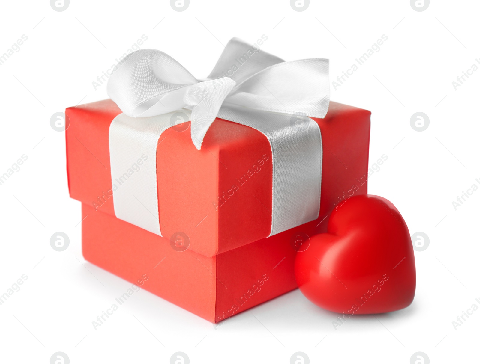 Photo of Beautiful gift box and red heart on white background. Valentine's day celebration