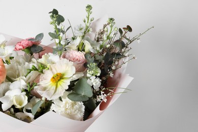 Photo of Bouquet of beautiful flowers on white background, closeup. Space for text