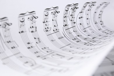 Photo of Rolled sheet with music notes, closeup view
