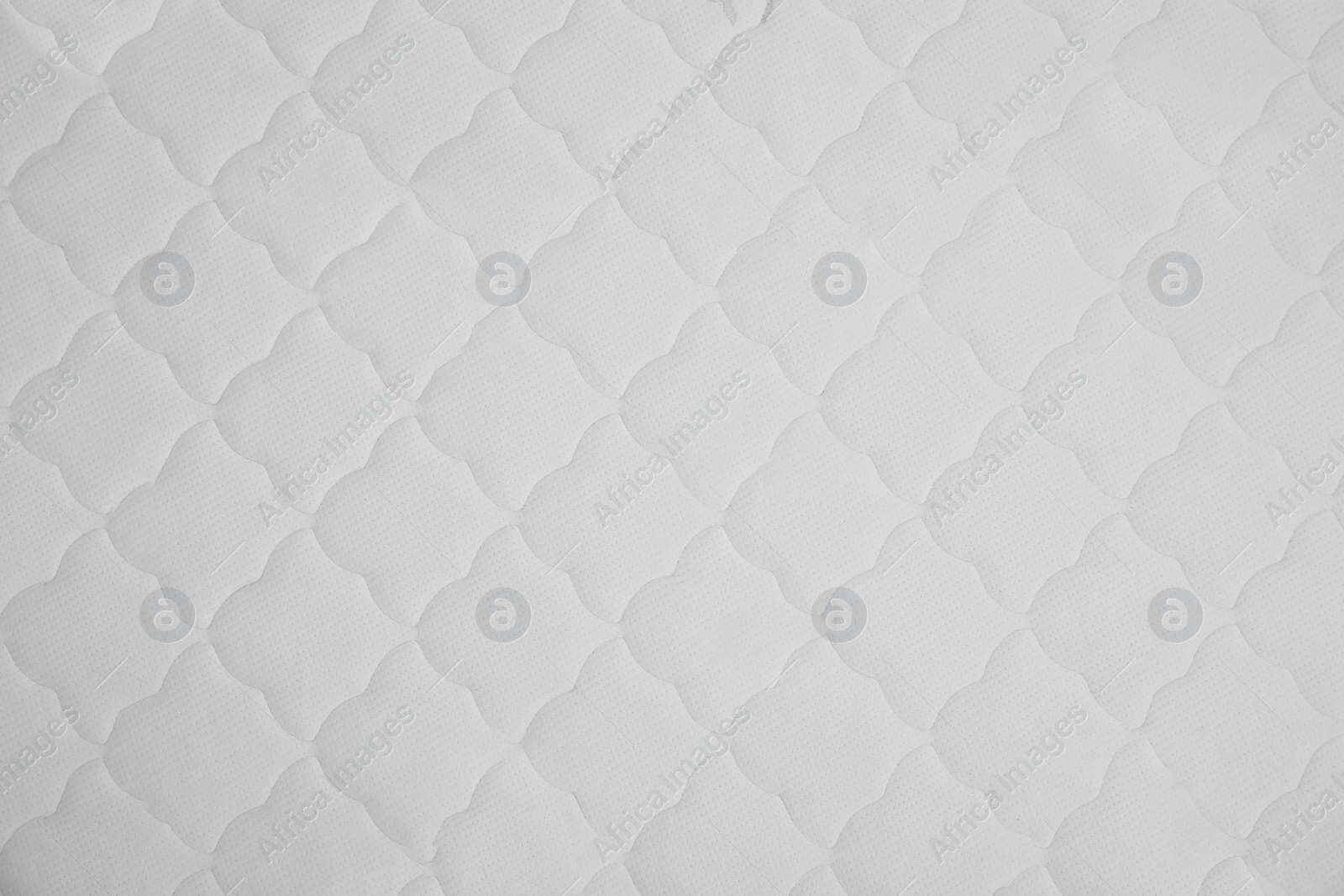 Photo of New white mattress as background, top view