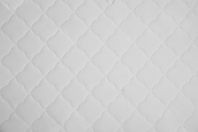 New white mattress as background, top view