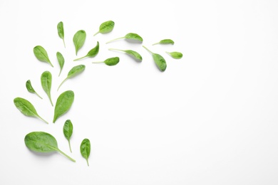 Photo of Fresh green healthy spinach on white background, top view