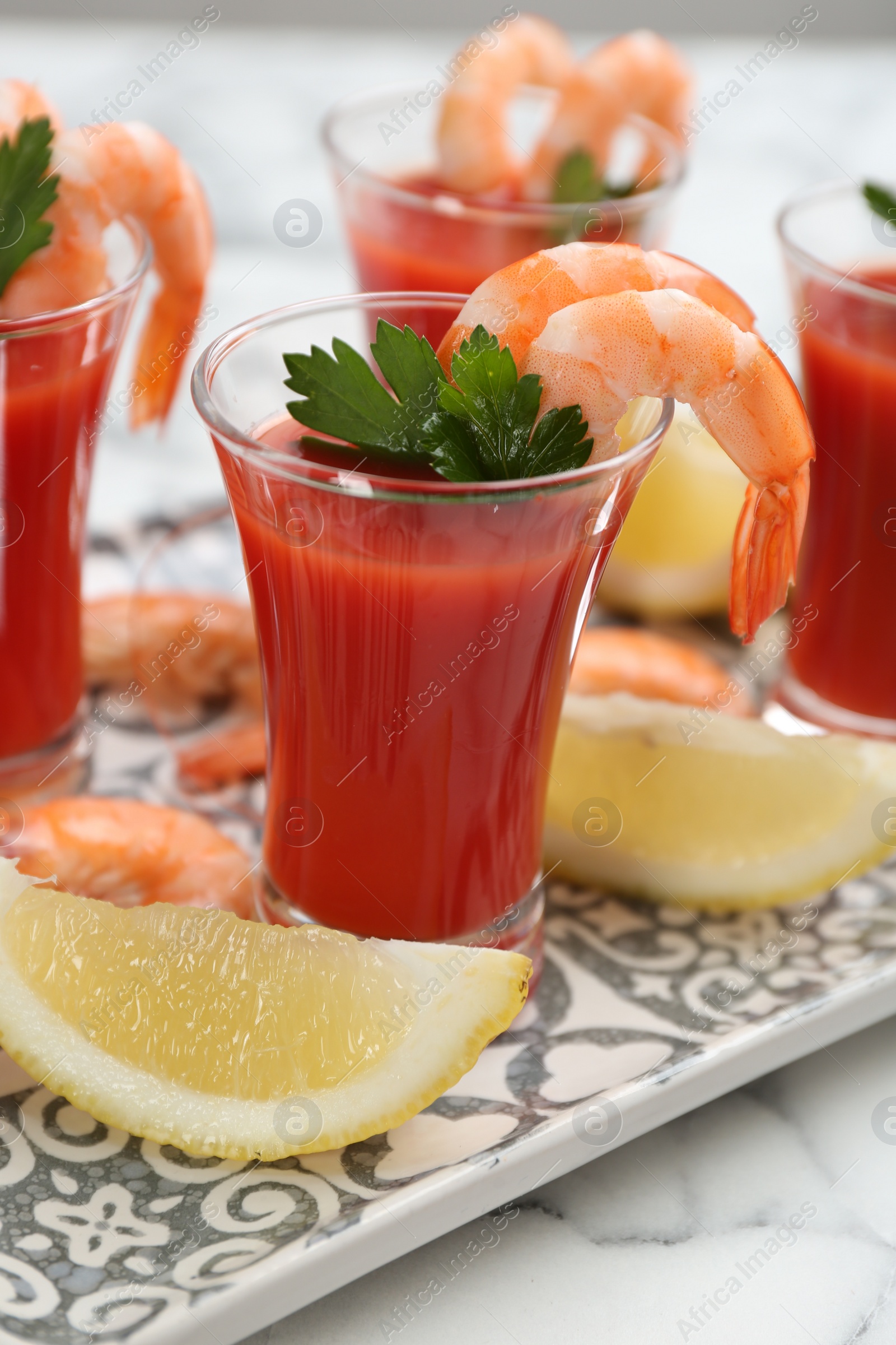 Photo of Delicious shrimp cocktail with tomato sauce, closeup