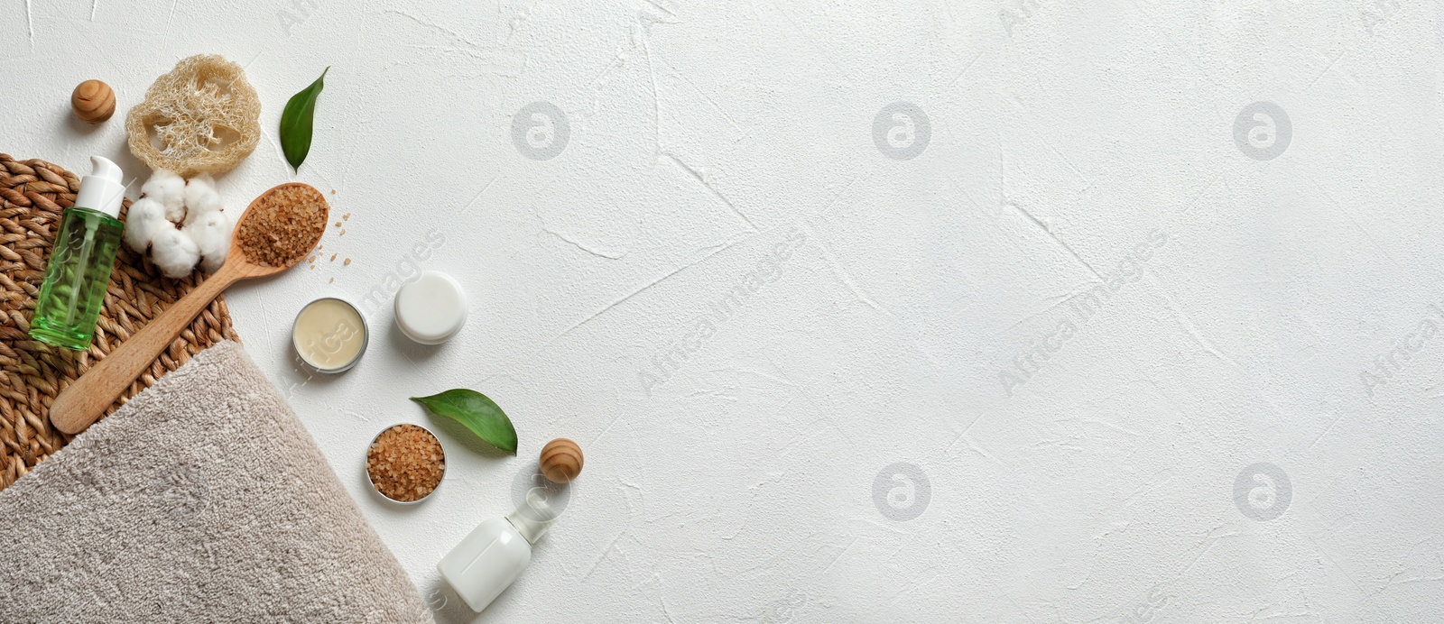 Image of Flat lay composition with towel and toiletries on white background, space for text. Banner design