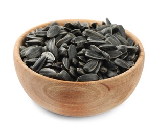 Raw organic sunflower seeds in wooden bowl isolated on white