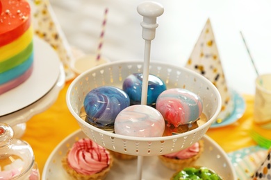 Photo of Delicious sweets prepared for birthday party on table indoors