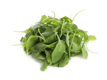 Photo of Fresh green arugula leaves on white background