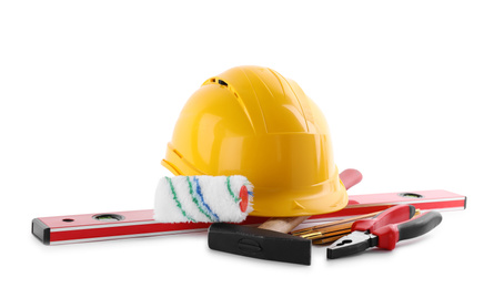 Photo of Different construction tools and hard hat isolated on white