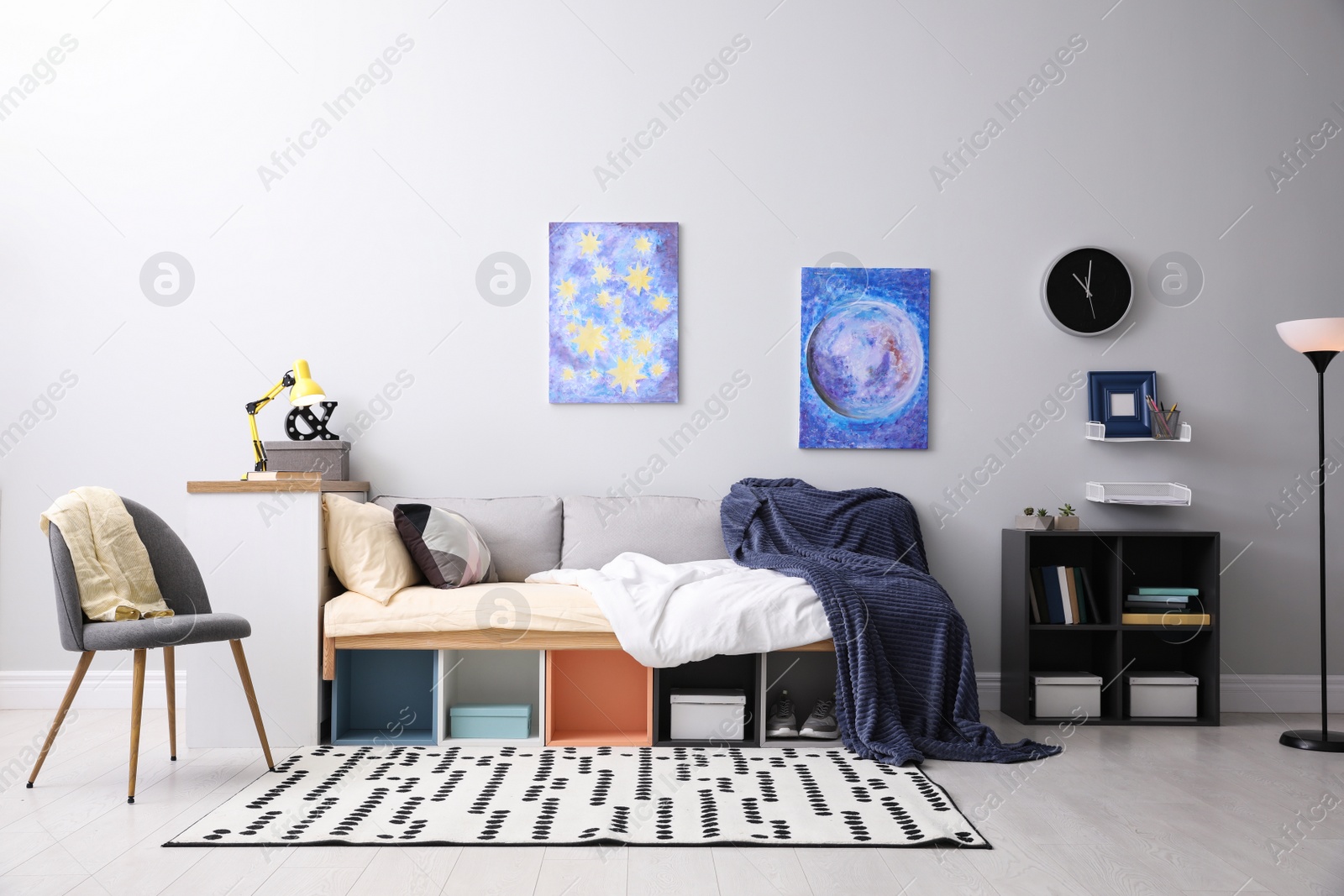 Photo of Modern teenager's room interior with comfortable bed and stylish design elements