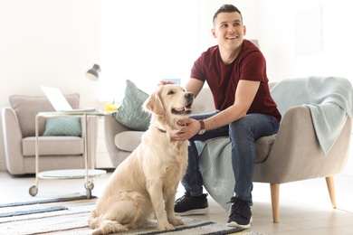 Portrait of owner with his friendly dog at home