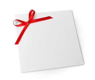 Blank gift tag with satin ribbon on white background